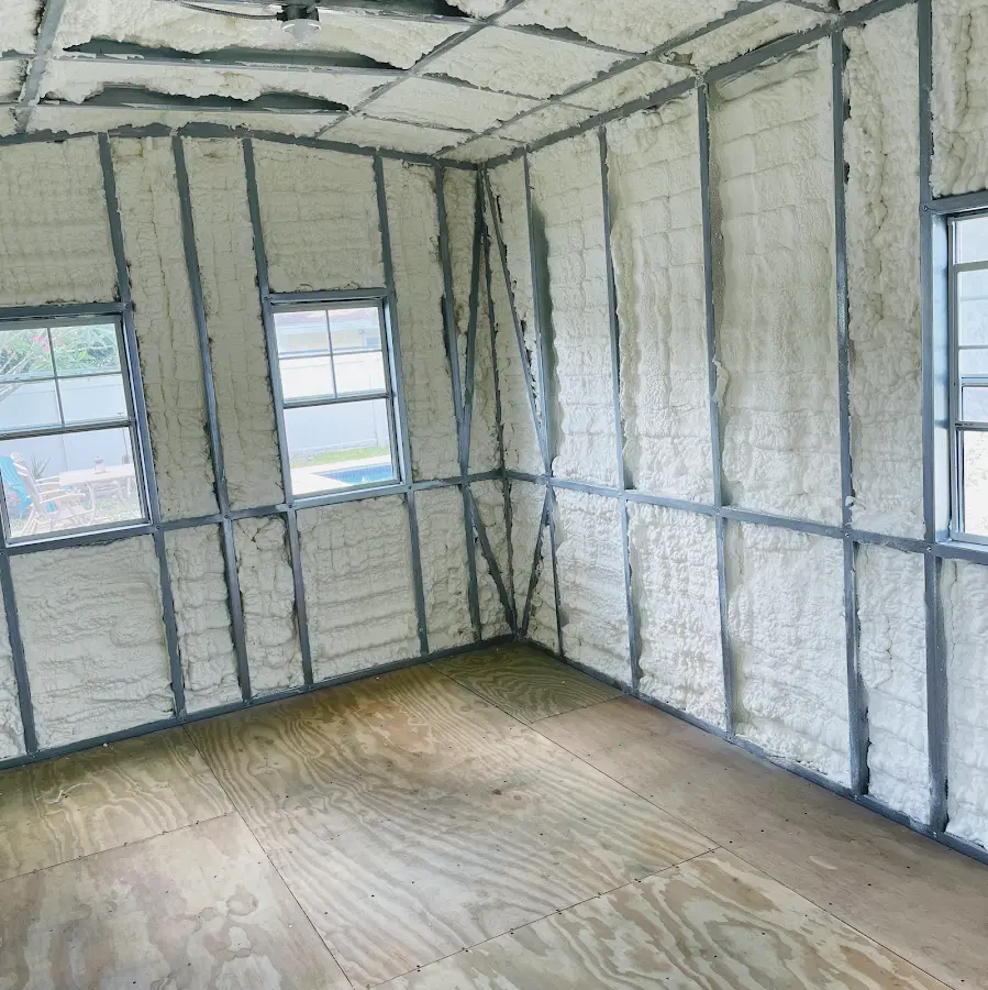 Closed-cell spray foam insulation applied to wall cavities in a residential project in Victor